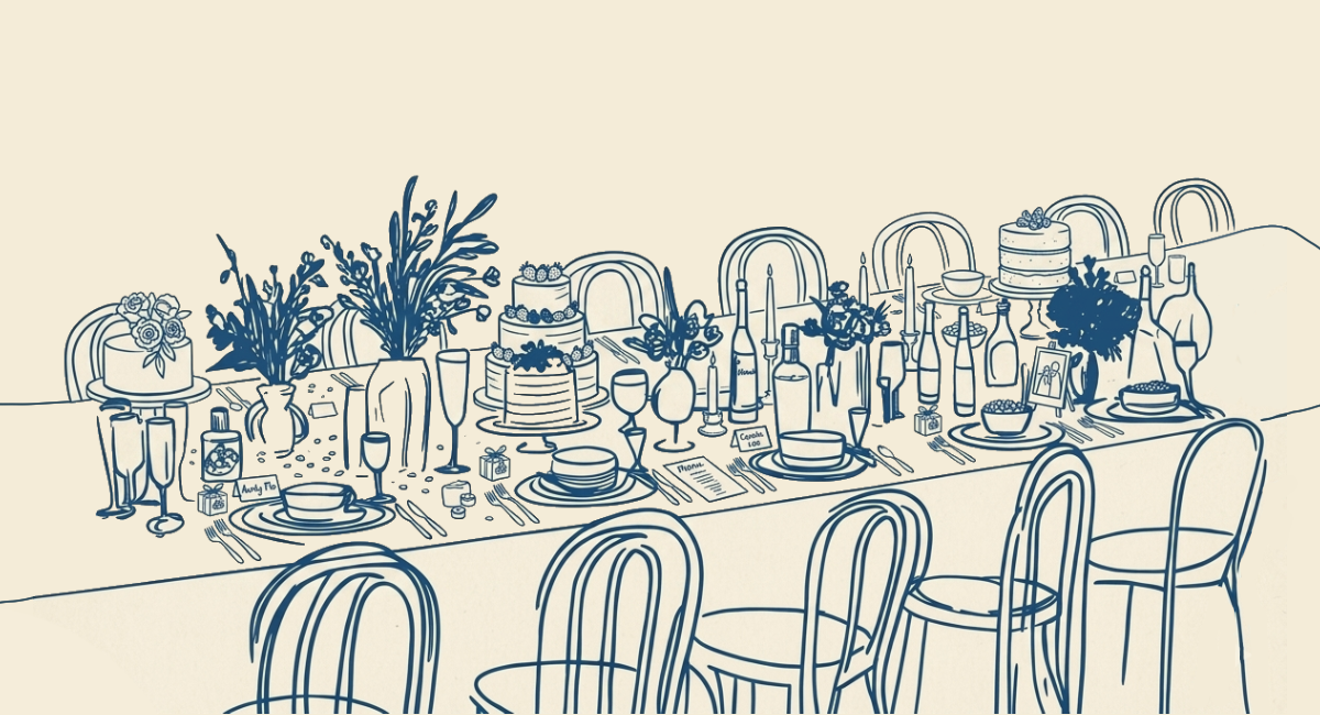 A long wedding dinner table with flowers, cake, candles and bistro chairs